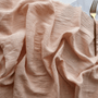 peach cotton table runner with gold cutlery
