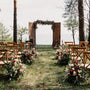 rustic wedding ceremony setup in outdoor garden