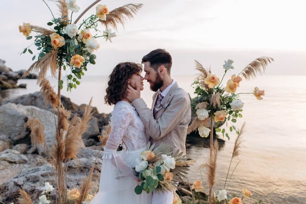 bride and groom in bohemian style beach wedding