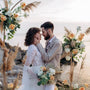 bride and groom in bohemian style beach wedding