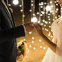 Couple getting married with beautiful lighting perfect for a rustic theme