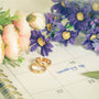 wedding reminder on calendar with rings and flowers